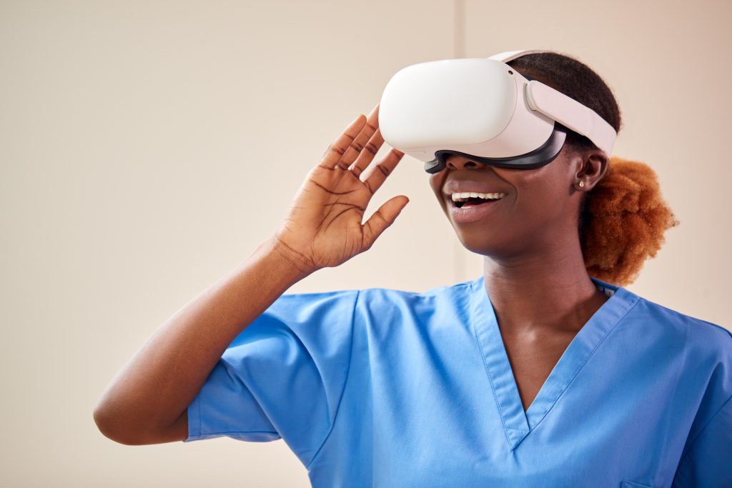 A female in scrubs and VR headset