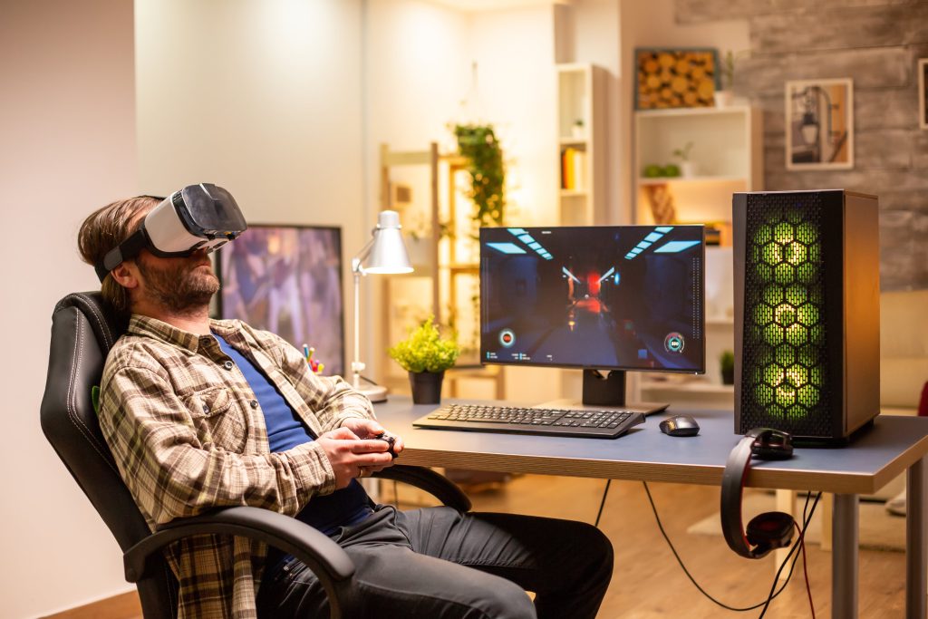 A man playing video games in VR headset