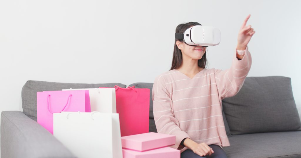 Woman using VR headset for online shopping